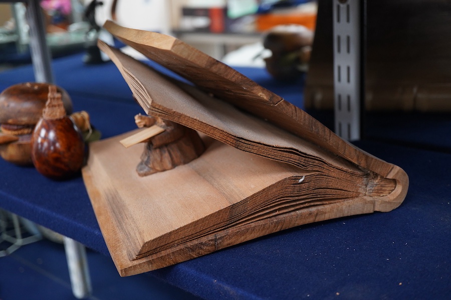 Pierre Decorse (b.1953), two carved wooden sculptures, an egg with a miniature town emanating from its top; and a stylised burger, largest 14cm wide